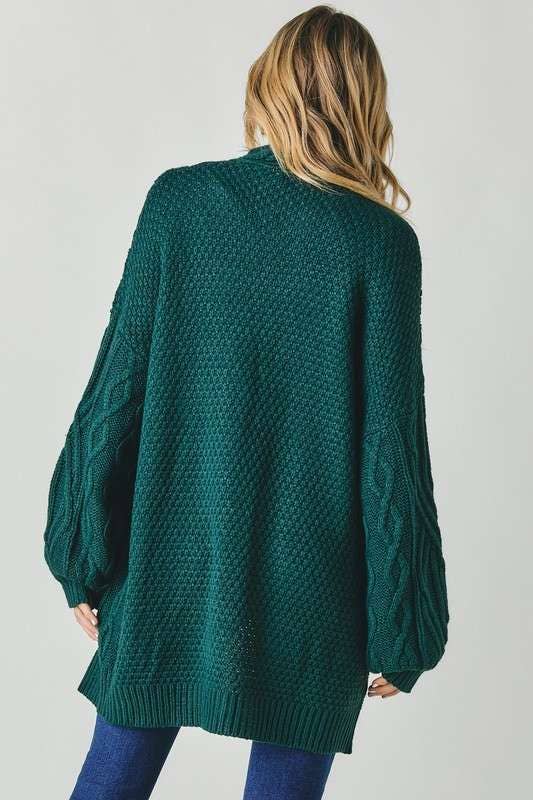 Loose-fit cable knit emerald sweater